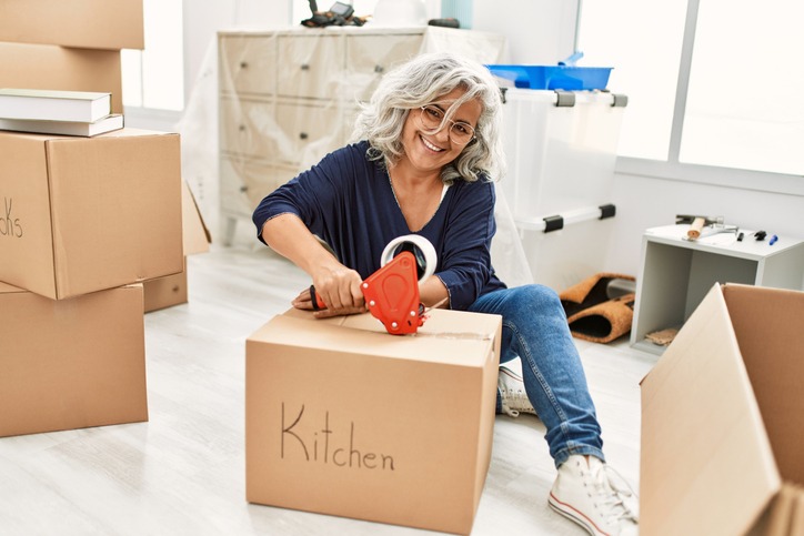 Woman packing up her kitchen